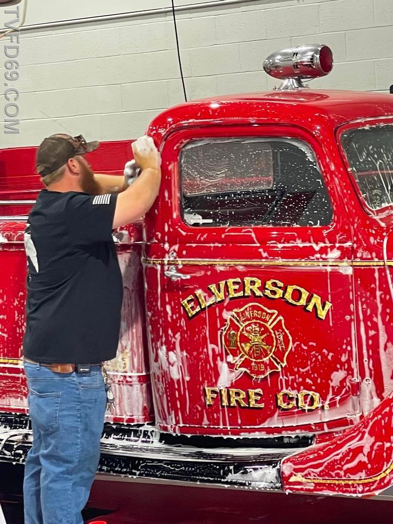 Chief Engineer Weiler taking some time to give the Antique a bath before our BBQ competition fundraiser